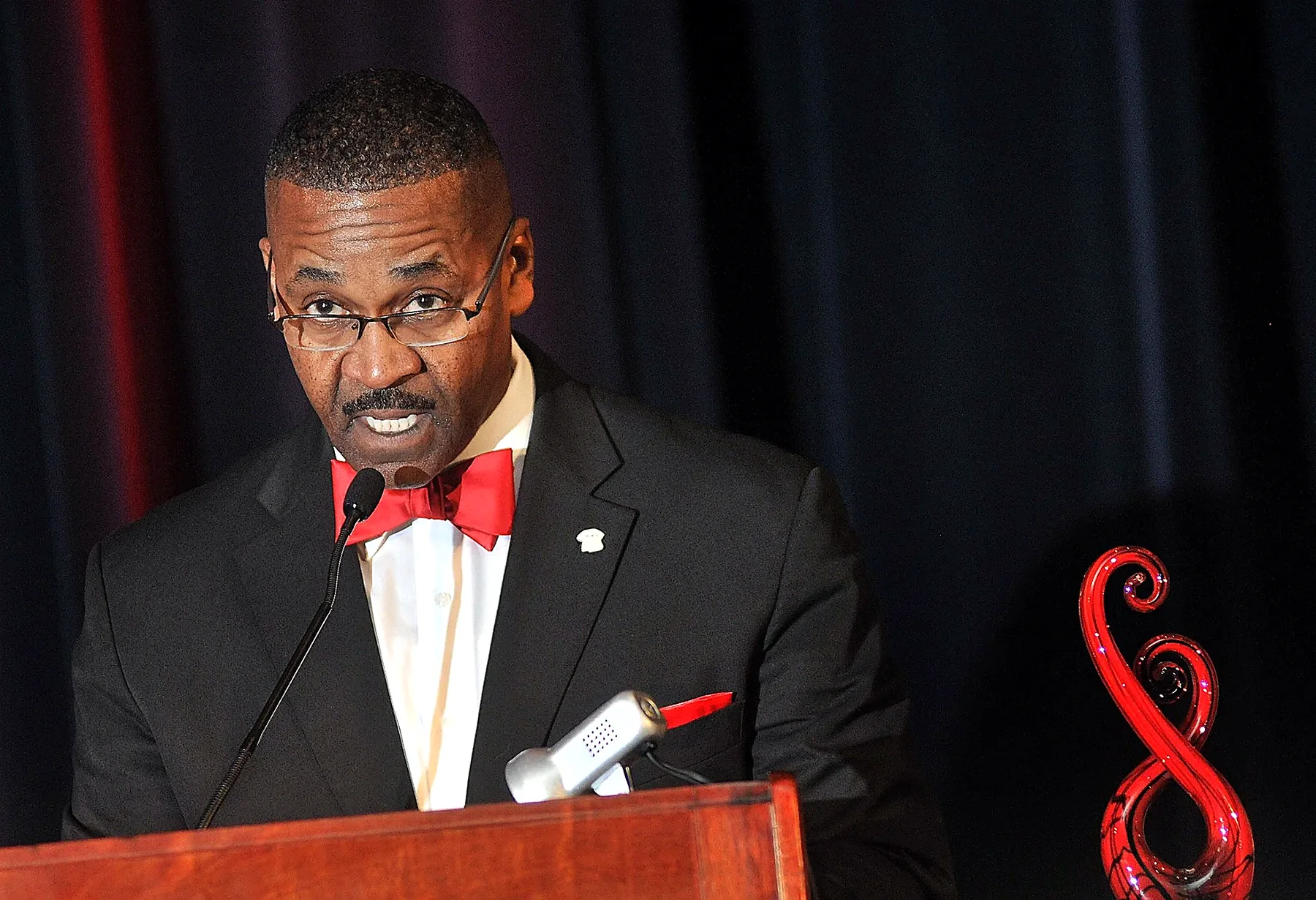 Rev. Moore speaking at a formal event
